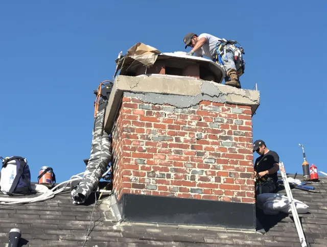 North Smithfield Chimney Sweep installing a custom chimney crown in North Smithfield, RI