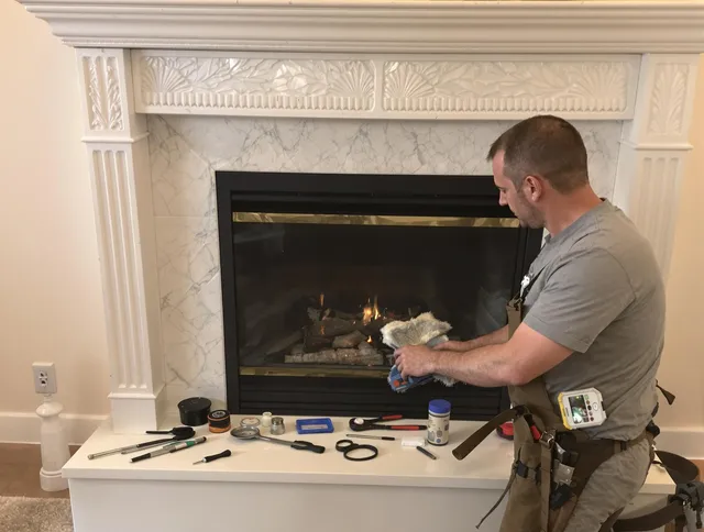 North Smithfield Chimney Sweep performing fireplace maintenance in North Smithfield, RI